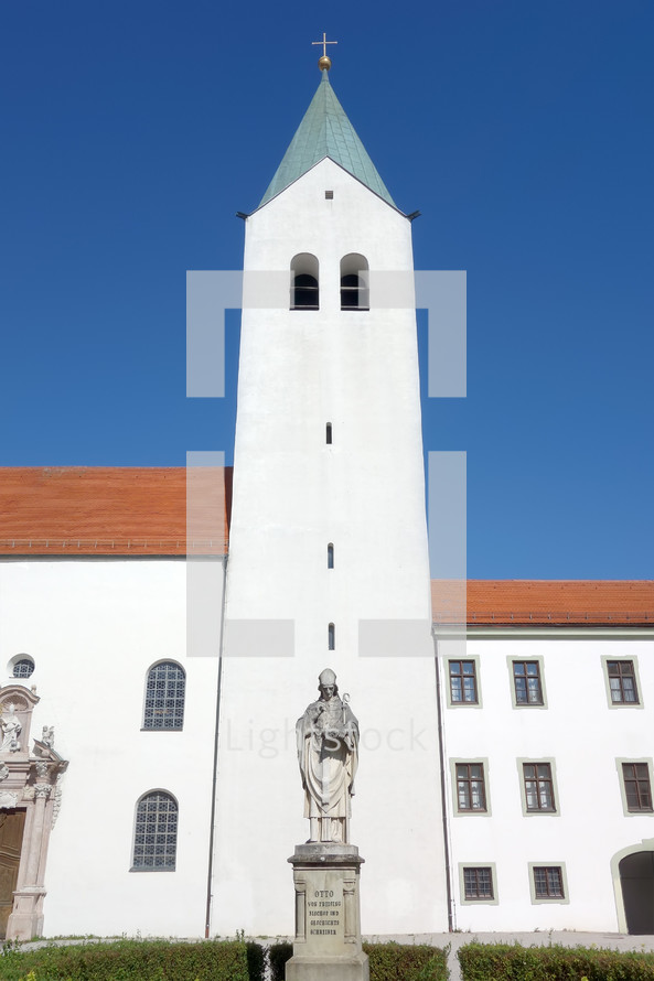 statues and white steeple 
