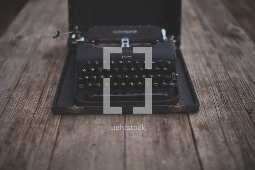 A vintage typewriter on a wooden table