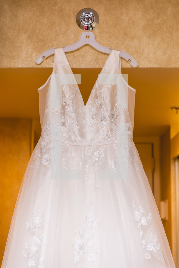 wedding gown hanging up