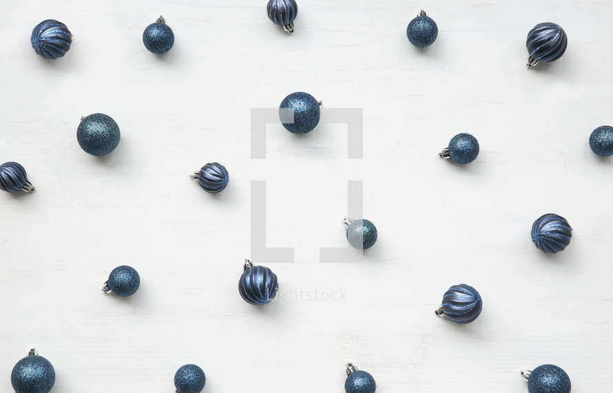 blue Christmas ornaments on a white background 