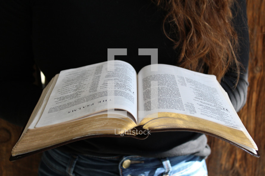 a woman reading the Bible 