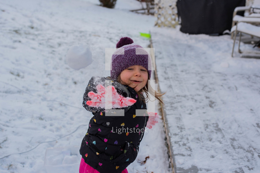 a child playing in snow 