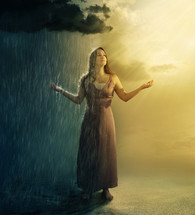 contrast, woman standing under a rain and sun 