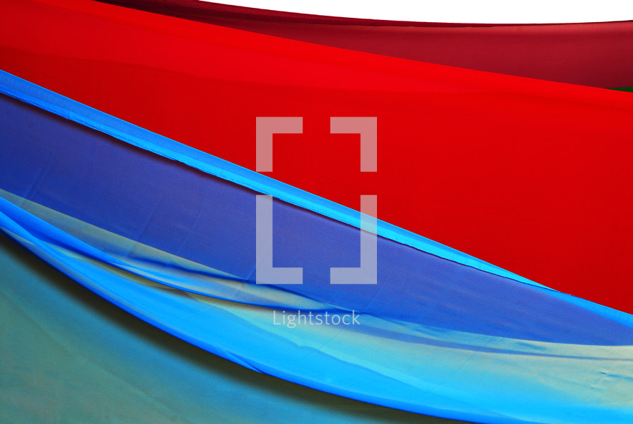 red and blue flowing fabric 