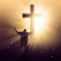 silhouette of a man in front of a glowing cross with his hands raised in praise