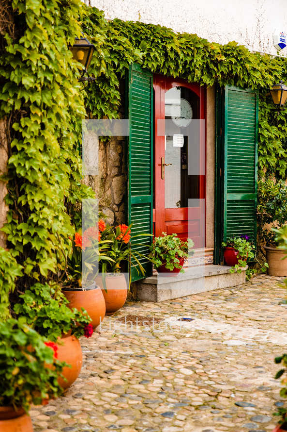 green shutters and red door in Spain 