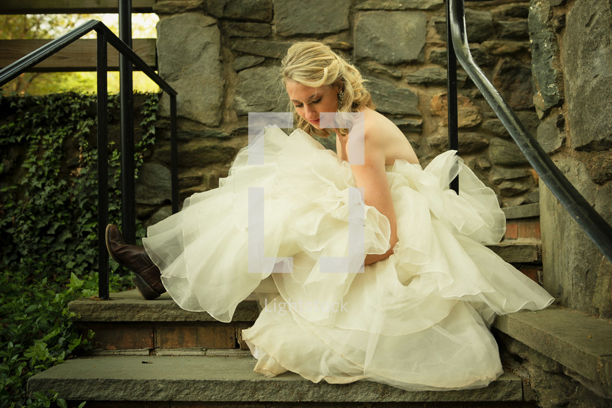 bride on the stairs outside