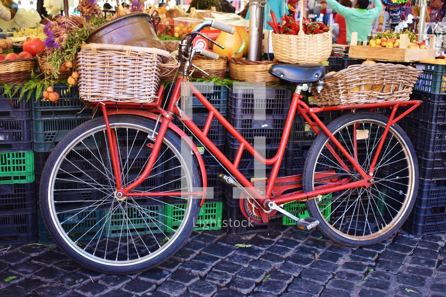 red bicycle at a market 
