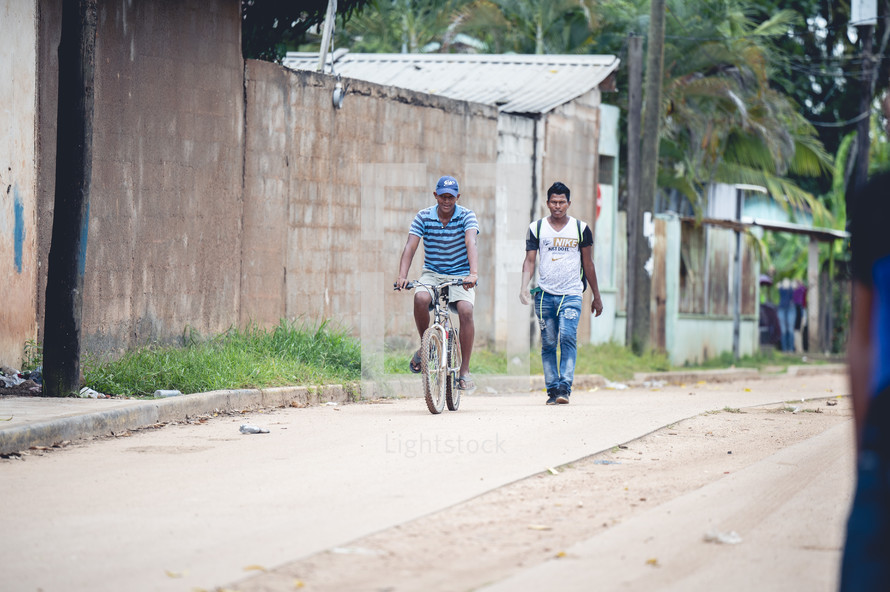 people on dirt roads in Honduras 
