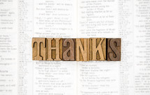 word thanks on the pages of a Bible 