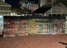 rainbow Boston sign at night 