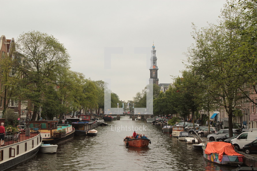 Boat glides along the canal in Amsterdam 