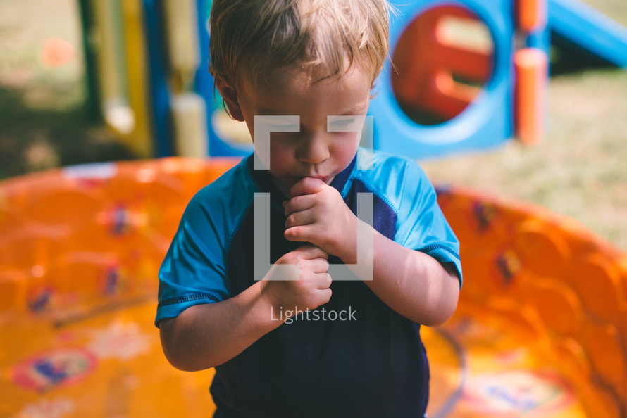 toddler boy eating a popsicle 