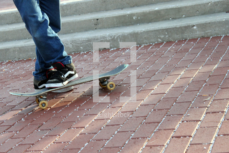 teens foot on a skateboard 