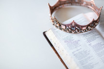 jeweled crown on the pages of an opened Bible 