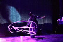 performer twirling a ribbon on stage