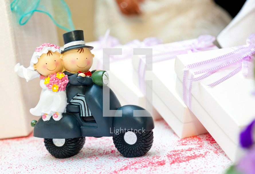 wedding day bride and groom on a scooter figurine 