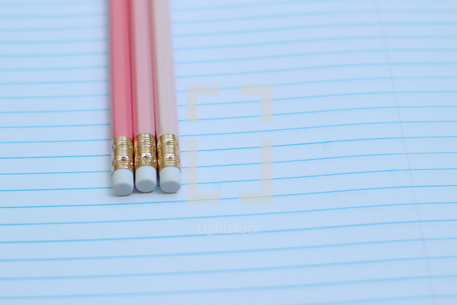 pencils on a notebook 