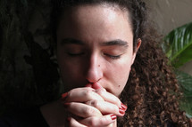 face a woman praying 