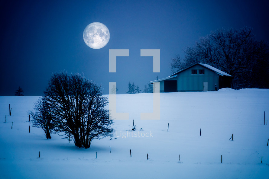 full moon over a winter scene 
