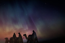 wise men traveling on camels at night 