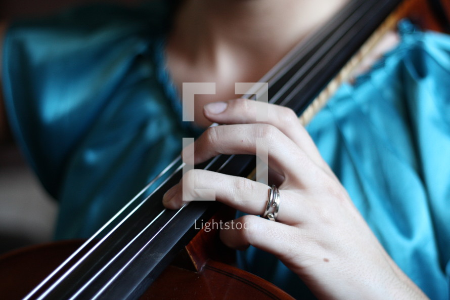 a woman playing a cello 