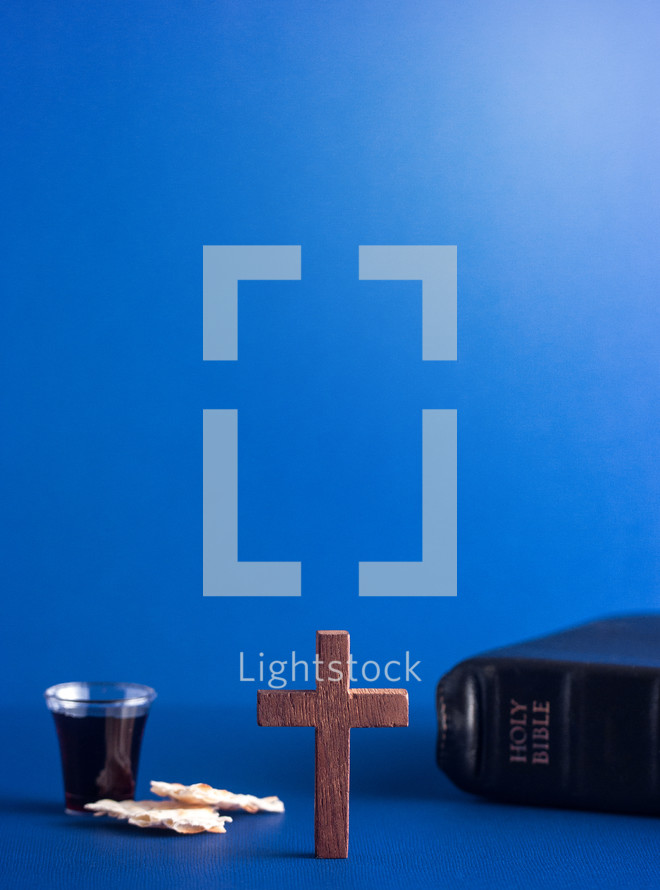 Symboles of Christianity and the Communion on a Blue Background