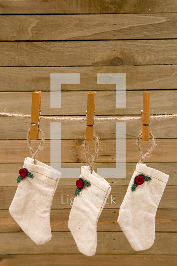 rustic Christmas stockings on a clothesline 