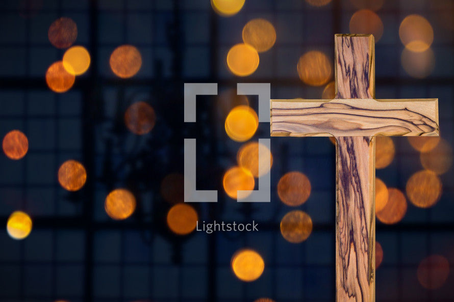 wooden cross and bokeh lights 