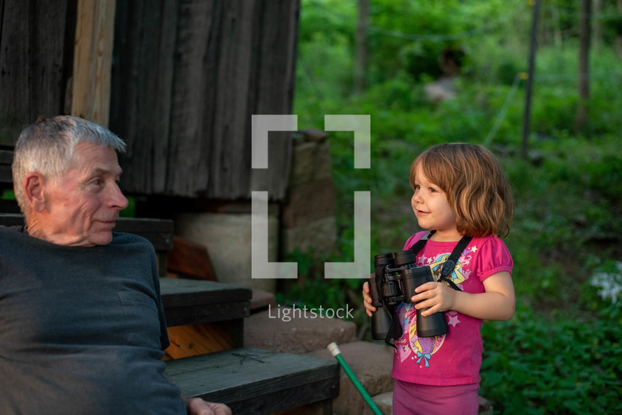 toddler girl with binoculars 