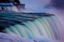 water pouring over Niagara Falls 