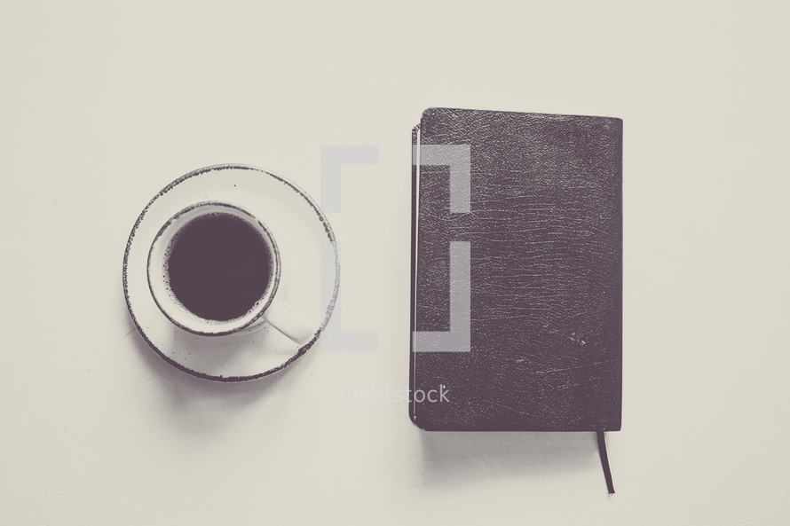 closed Bible and coffee cup 