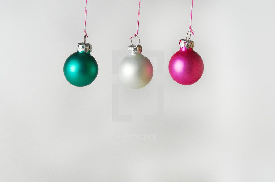 green,, white, and fuchsia Christmas ornaments 
