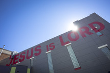 words Jesus is Lord on the side of a building 