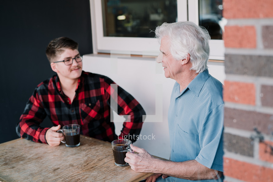 men having coffee together 