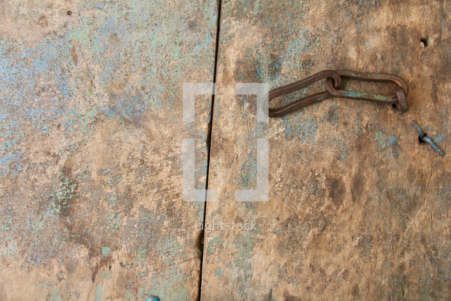 rusty chain on a metal door 