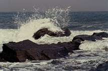 waves splashing over rocks 