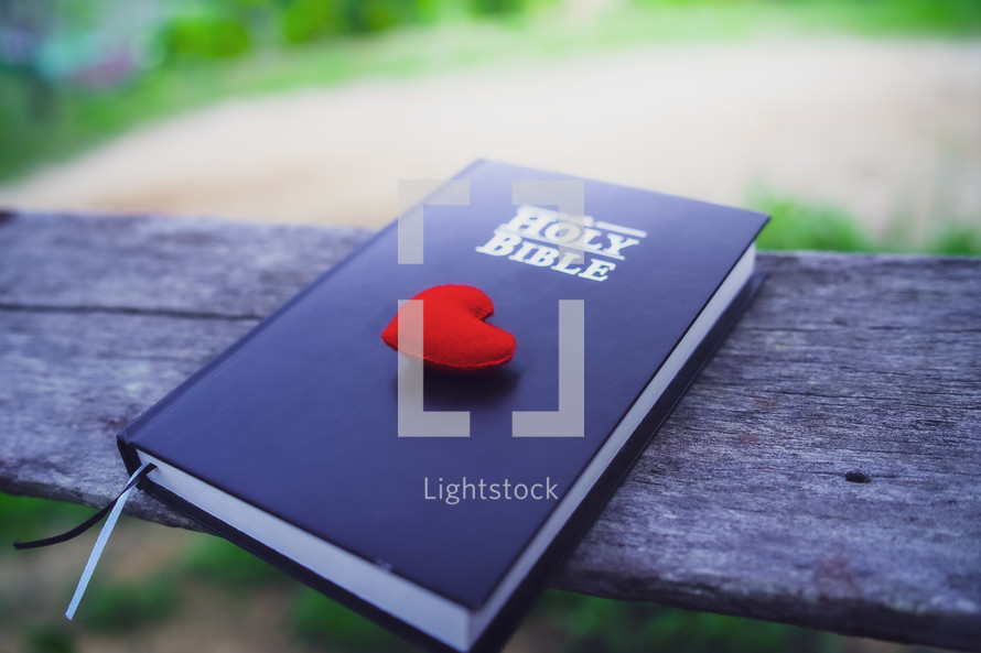 Red fabric heart on a Bible