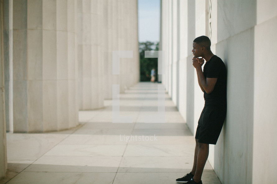 African American young man in prayer 