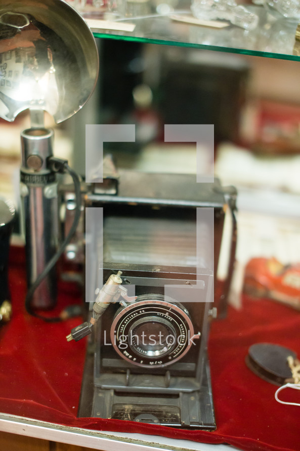 Antique display with a vintage camera.