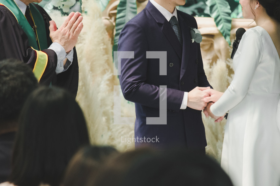 bride and groom exchanging vows 