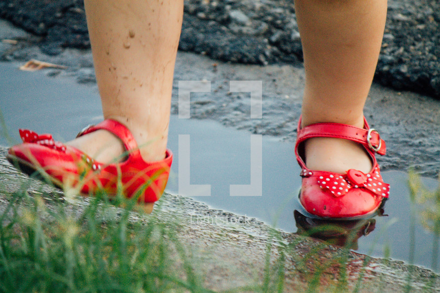 red shoes in a puddle 