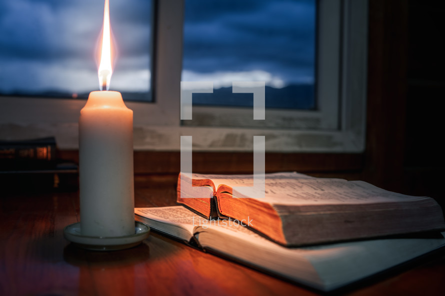 Bible with candlelight