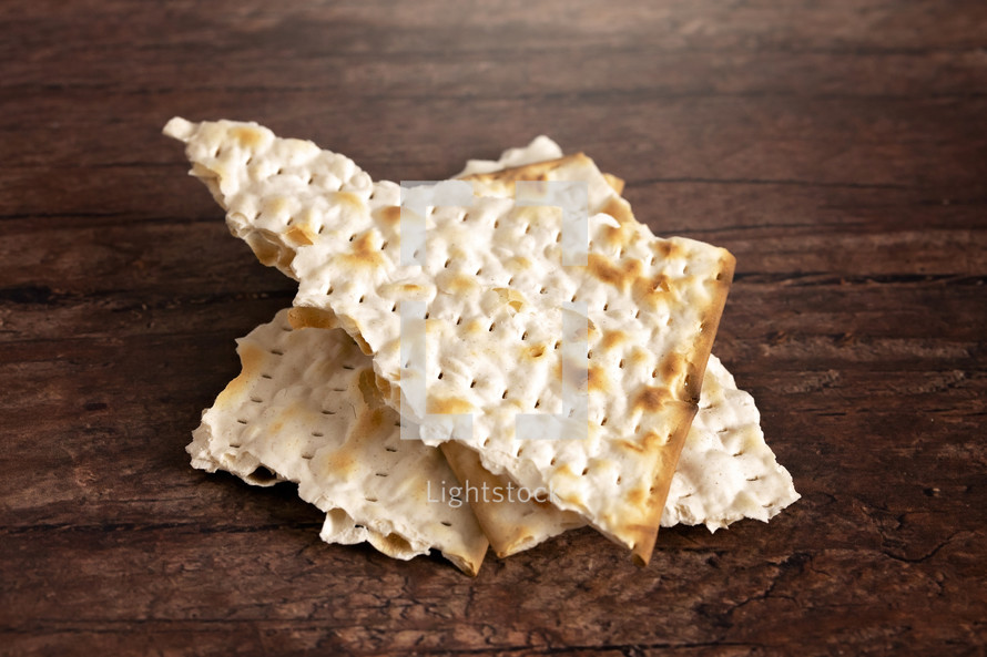 The Unleavened Bread for Holy Communion or the Lords Supper Prepared on a Dark Wood Table