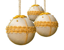 Homemade christmas balls coated with golden fabric on white background
