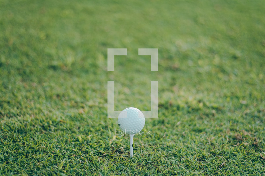 golf ball on a golf tee 