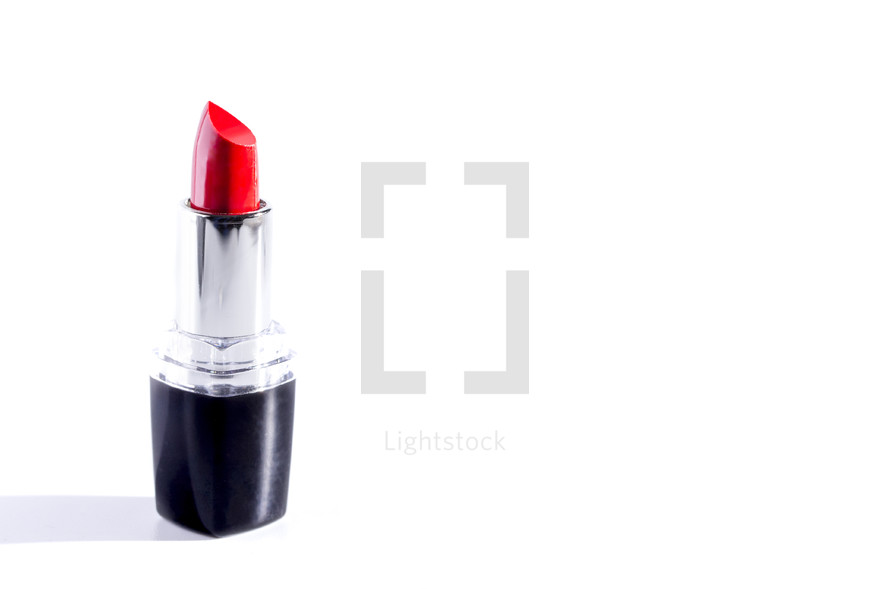 red lipstick against a white background 