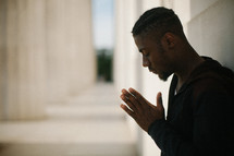African American young man in prayer 