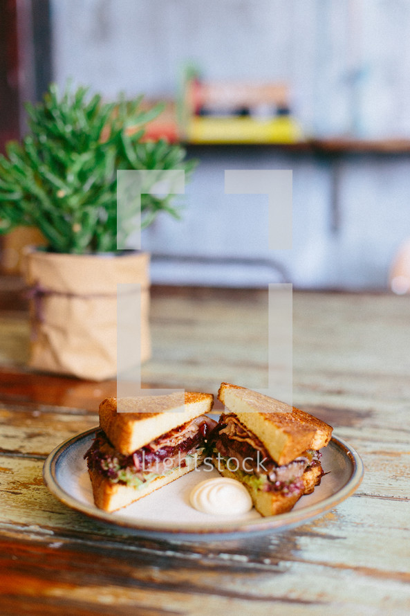 sandwich on a plate on a table 