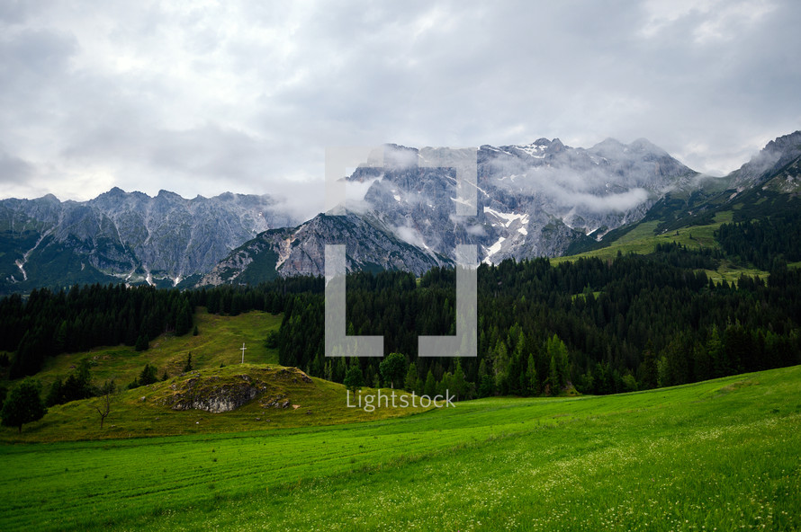 green meadow and mountain peaks 